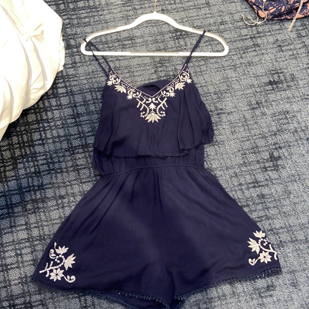 Navy Romper with white embroidered design